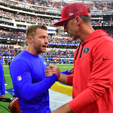 Oct 30, 2022; Inglewood, California, USA; Los Angeles Rams head coach Sean McVay meets with San Francisco 49ers head coach Kyle Shanahan following the game at SoFi Stadium. Mandatory Credit: Gary A. Vasquez-Imagn Images