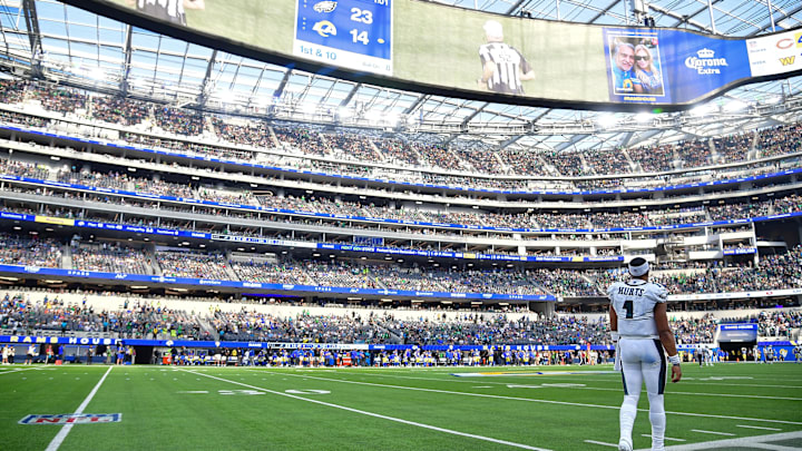 Oct 8, 2023; Inglewood, California, USA; Philadelphia Eagles quarterback Jalen Hurts (1) watches game action against the Los Angeles Rams during the second half at SoFi Stadium. Mandatory Credit: Gary A. Vasquez-Imagn Images