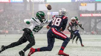 Jan 7, 2024; Foxborough, Massachusetts, USA; New York Jets safety Tony Adams (22) defends against New England Patriots tight end Mike Gesicki (88) in the first half at Gillette Stadium.