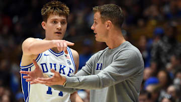 Nov 11, 2022; Durham, North Carolina, USA;  Duke Blue Devils head coach Jon Scheyer (right) instructs guard Jaden Schutt during the second half at Cameron Indoor Stadium. Mandatory Credit: Rob Kinnan-Imagn Images