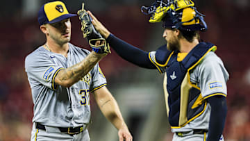 Aug 30, 2024; Cincinnati, Ohio, USA; Milwaukee Brewers starting pitcher DL Hall (37) high fives catcher Eric Haase (13) at the end of the seventh inning in the game against the Cincinnati Reds at Great American Ball Park. Mandatory Credit: Katie Stratman-USA TODAY Sports