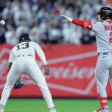 Sep 30, 2025; Bronx, New York, USA; Boston Red Sox third baseman Alex Bregman (2) celebrates his RBI double against the New York Yankees during the ninth inning of game one of the Wildcard round of the 2025 MLB playoffs at Yankee Stadium. Mandatory Credit: Brad Penner-Imagn Images