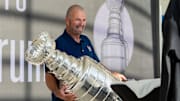 Florida Panthers General Manager Bill Zito places the Stanley Cup on a table on Wednesday August 14, 2024 at Fiserv Forum in Milwaukee, Wis.