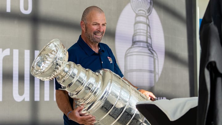 Florida Panthers General Manager Bill Zito places the Stanley Cup on a table on Wednesday August 14, 2024 at Fiserv Forum in Milwaukee, Wis.