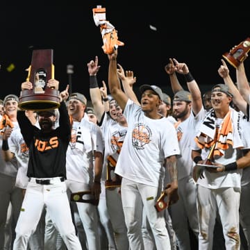 Jun 24, 2024; Omaha, NE, USA;  Tennessee Volunteers head coach Tony Vitello holds the national championship trophy after the win against the Texas A&M Aggies at Charles Schwab Field Omaha. Mandatory Credit: Steven Branscombe-USA TODAY Sports