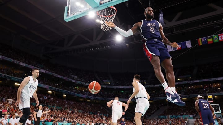  Lebron James #6 of Team United States dunks the ball against Team Serbia during the first half of the Men's Group Phase - Group C game between Serbia and the United States on day two of the Olympic Games Paris 2024 at Stade Pierre Mauroy on July 28, 2024 in Lille, France. (Photo by Gregory Shamus/Getty Images)