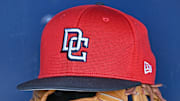 Aug 12, 2025; Kansas City, Missouri, USA;  A Washington Nationals hat and glove in the dugout before a game against the Kansas City Royals at Kauffman Stadium. 