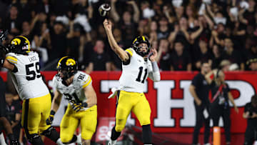 Sep 19, 2025; Piscataway, New Jersey, USA; Iowa Hawkeyes quarterback Mark Gronowski (11) throws a pass during the first half against the Rutgers Scarlet Knights at SHI Stadium. Mandatory Credit: Vincent Carchietta-Imagn Images