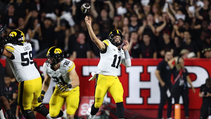 Sep 19, 2025; Piscataway, New Jersey, USA; Iowa Hawkeyes quarterback Mark Gronowski (11) throws a pass during the first half against the Rutgers Scarlet Knights at SHI Stadium. Mandatory Credit: Vincent Carchietta-Imagn Images
