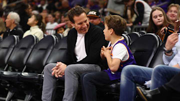 Dec 27, 2024; Phoenix, Arizona, USA; Phoenix Suns owner Mat Ishbia sits courtside with his son against the Dallas Mavericks at Footprint Center. Mandatory Credit: Mark J. Rebilas-Imagn Images