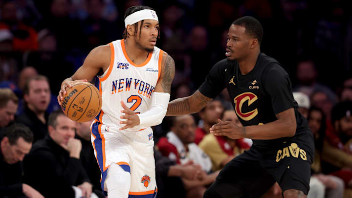 Apr 11, 2025; New York, New York, USA; New York Knicks guard Miles McBride (2) controls the ball against Cleveland Cavaliers guard Javonte Green (8) during the second quarter at Madison Square Garden. Mandatory Credit: Brad Penner-Imagn Images