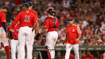 Aug 20, 2019; Boston, MA, USA; Boston Red Sox Manager Alex Cora (20) walks to the mound to make a pitching change during the third inning against the Philadelphia Phillies at Fenway Park. Mandatory Credit: Paul Rutherford-Imagn Images