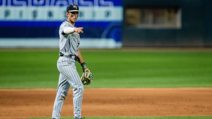 May 24, 2024; Charlotte, NC, USA; Wake Forest infielder Marek Houston (7) celebrates after getting an out at home in the eleventh inning against the North Carolina Tar Heels during the ACC Baseball Tournament at Truist Field. Mandatory Credit: Scott Kinser-USA TODAY Sports