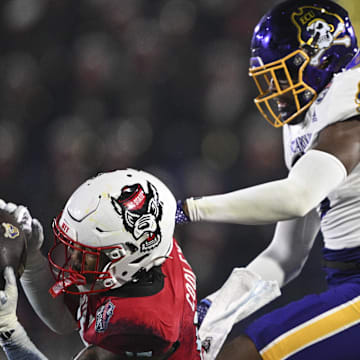 Dec 28, 2024; Annapolis, MD, USA;  North Carolina State Wolfpack cornerback Tamarcus Cooley (15) intercepts a pass during the second half of the  Go Bowling Military Bowl against the East Carolina Pirates at Navy-Marine Corps Memorial Stadium. Mandatory Credit: Tommy Gilligan-Imagn Images