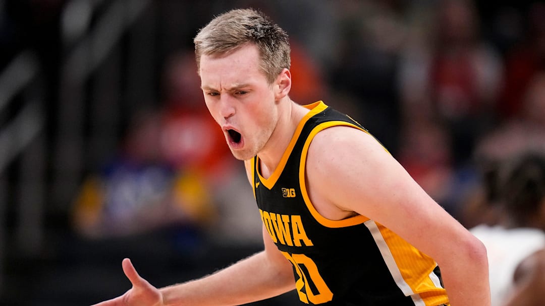 Iowa Hawkeyes forward Payton Sandfort (20) yells in excitement after scoring a three point basket Thursday, March 13, 2025, during the second round of the men's Big Ten tournament at Gainbridge Fieldhouse in Indianapolis. The Illinois Fighting Illini defeated the Iowa Hawkeyes, 106-94.