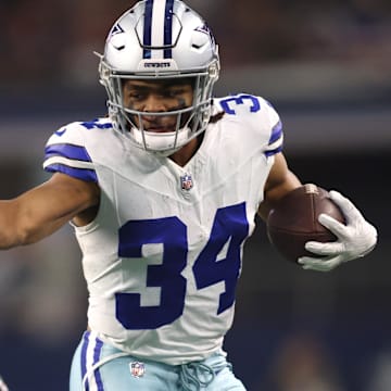Dallas Cowboys running back Malik Davis runs the ball against the Las Vegas Raiders in the first quarter at AT&T Stadium.