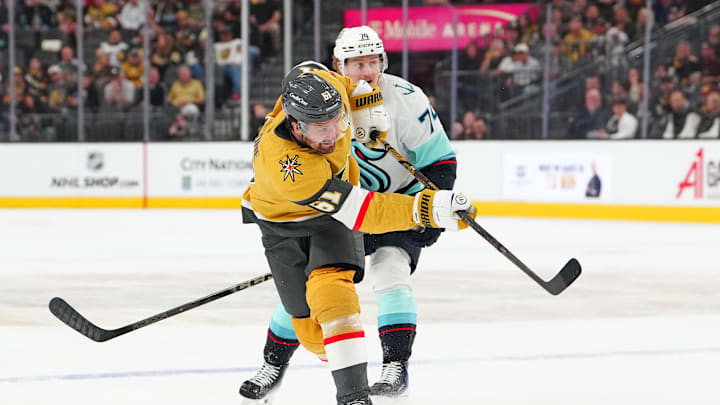 Apr 15, 2026; Las Vegas, Nevada, USA; Vegas Golden Knights right wing Mark Stone (61) shoots in front of Seattle Kraken center Bobby McMann (74) during the second period at T-Mobile Arena. Mandatory Credit: Stephen R. Sylvanie-Imagn Images