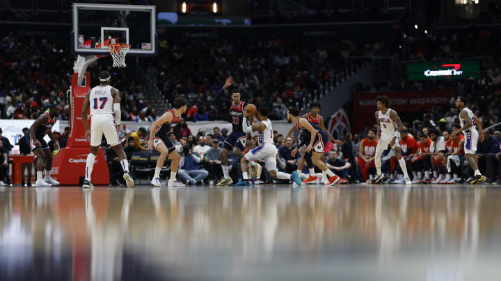 Feb 10, 2024; Washington, District of Columbia, USA; Philadelphia 76ers forward KJ Martin (1) drives to the basket as Washington Wizards forward Kyle Kuzma (33) defends in the second half at Capital One Arena. Mandatory Credit: Geoff Burke-USA TODAY Sports