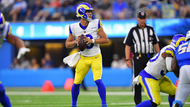 Aug 17, 2024; Inglewood, California, USA; Los Angeles Rams quarterback Stetson Bennett (13) drops back to pass against the Lo