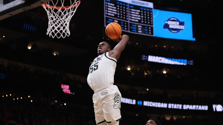 Mar 28, 2025; Atlanta, GA, USA; Michigan State Spartans forward Coen Carr (55) dunks against Mississippi Rebels forward Malik Dia (0) in the second half of a South Regional semifinal of the 2025 NCAA tournament at State Farm Arena. Mandatory Credit: Brett Davis-Imagn Images