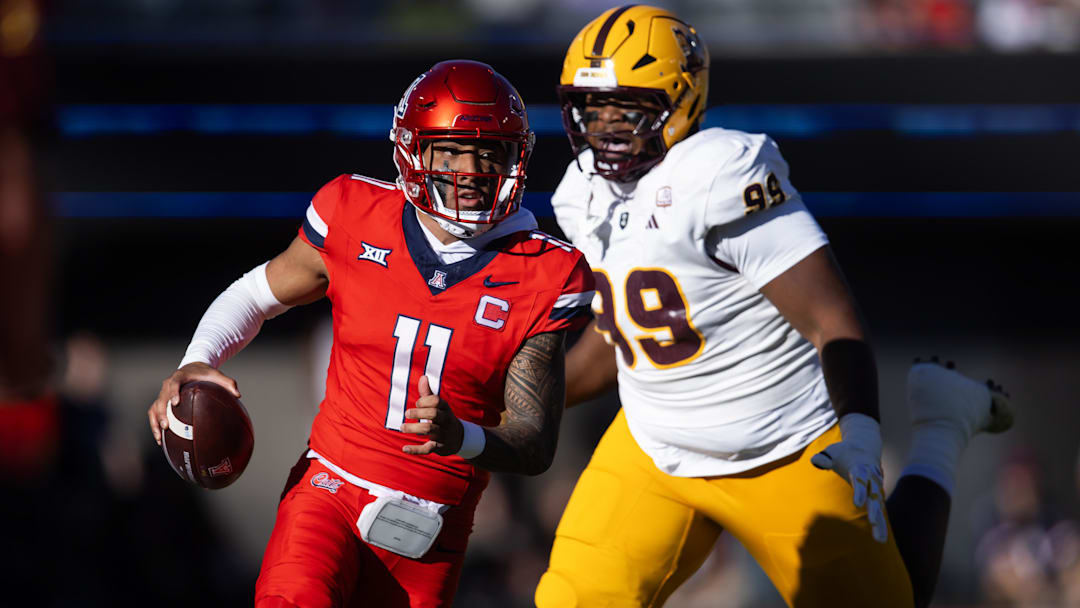 Nov 30, 2024; Tucson, Arizona, USA; Arizona Wildcats quarterback Noah Fifita (11) against the Arizona State Sun Devils during the Territorial Cup at Arizona Stadium.