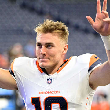 Aug 11, 2024; Indianapolis, Indiana, USA; Denver Broncos quarterback Bo Nix (10) waves to fans after the game against the Indianapolis Colts at Lucas Oil Stadium. 