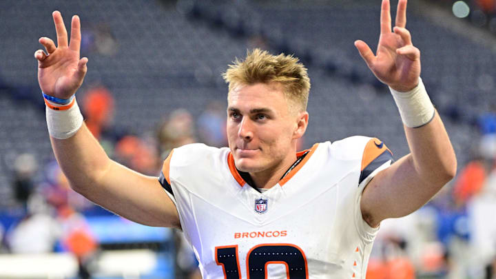 Aug 11, 2024; Indianapolis, Indiana, USA; Denver Broncos quarterback Bo Nix (10) waves to fans after the game against the Indianapolis Colts at Lucas Oil Stadium. 