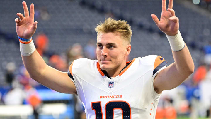 Aug 11, 2024; Indianapolis, Indiana, USA; Denver Broncos quarterback Bo Nix (10) waves to fans after the game against the Indianapolis Colts  at Lucas Oil Stadium. 