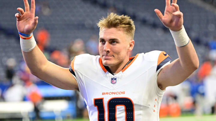 Denver Broncos quarterback Bo Nix (10) waves to fans after the game against the Indianapolis Colts at Lucas Oil Stadium.