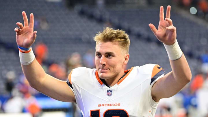 Broncos quarterback Bo Nix waves to fans after the game against the Indianapolis Colts at Lucas Oil Stadium.