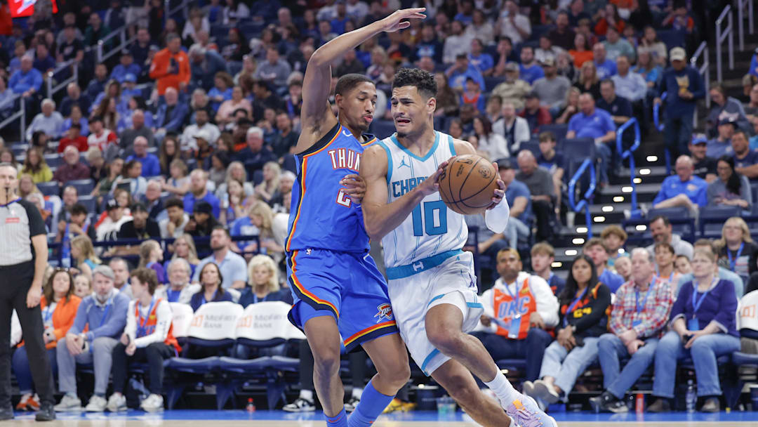Mar 21, 2025; Oklahoma City, Oklahoma, USA; Charlotte Hornets guard Josh Green (10) drives to the basket as Oklahoma City Thunder guard Aaron Wiggins (21) defends during the second half at Paycom Center. Mandatory Credit: Alonzo Adams-Imagn Images Mar 21, 2025; Oklahoma City, Oklahoma, USA; Charlotte Hornets guard Josh Green (10) drives to the basket as Oklahoma City Thunder guard Aaron Wiggins (21) defends during the second half at Paycom Center. Mandatory Credit: Alonzo Adams-Imagn Images