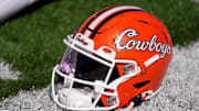 An Oklahoma State helmet is pictured before a college football game between the Oklahoma State Cowboys (OSU) and the West Virginia Mountaineers at Boone Pickens Stadium in Stillwater, Okla., Saturday, Oct. 5, 2024.