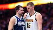 Mar 17, 2024; Dallas, Texas, USA;  Dallas Mavericks guard Luka Doncic (77) speaks with Denver Nuggets center Nikola Jokic (15) during the second half at American Airlines Center. Mandatory Credit: Kevin Jairaj-Imagn Images