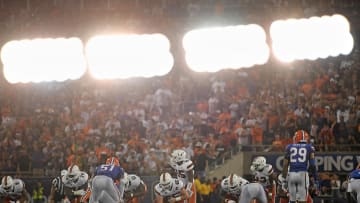 Aug 24, 2019; Orlando, FL, USA; (Editors note in camera double exposure) Miami Hurricanes quarterback Jarren Williams (15) calls a play at the line during the second half against the Florida Gators at Camping World Stadium. Mandatory Credit: Jasen Vinlove-USA TODAY Sports