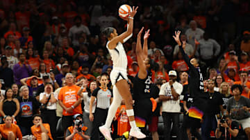 Oct 8, 2025; Phoenix, Arizona, USA; Las Vegas Aces center A'ja Wilson (22) makes a makes the game winning shot against Phoenix Mercury forward Alyssa Thomas (25) in the second half during game three of the 2025 WNBA Finals at PHX Arena. Mandatory Credit: Mark J. Rebilas-Imagn Images