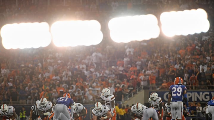 Aug 24, 2019; Orlando, FL, USA; (Editors note in camera double exposure) Miami Hurricanes quarterback Jarren Williams (15) calls a play at the line during the second half against the Florida Gators at Camping World Stadium. Mandatory Credit: Jasen Vinlove-USA TODAY Sports