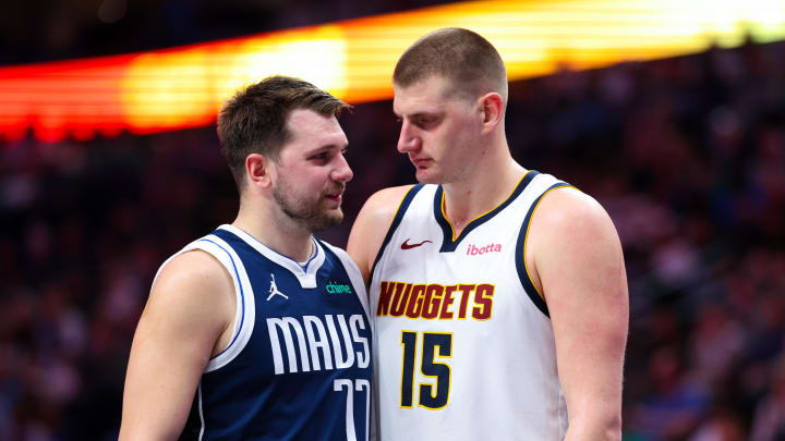 Mar 17, 2024; Dallas, Texas, USA;  Dallas Mavericks guard Luka Doncic (77) speaks with Denver Nuggets center Nikola Jokic (15) during the second half at American Airlines Center. Mandatory Credit: Kevin Jairaj-USA TODAY Sports