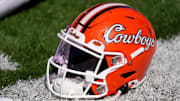 An Oklahoma State helmet is pictured before a college football game between the Oklahoma State Cowboys (OSU) and the West Virginia Mountaineers at Boone Pickens Stadium in Stillwater, Okla., Saturday, Oct. 5, 2024.