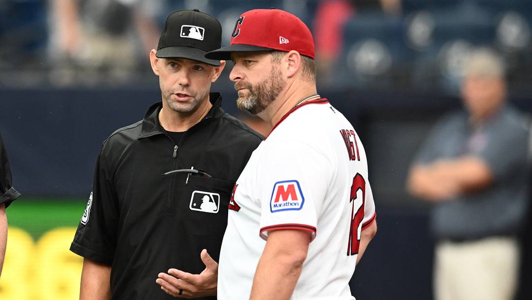 Aug 2, 2026; Cleveland, Ohio, USA; Umpire Will Little (93) talks to Cleveland Guardians manager Stephen Vogt (12) during a rain delay in the game between the Guardians and the Arizona Diamondbacks at Progressive Field. Mandatory Credit: Ken Blaze-Imagn Images
