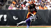 Cincinnati Bengals tight end Erick All Jr. (83) leaps over Baltimore Ravens defensive back Brandon Stephens (21) in the third quarter of the NFL game at Paycor Stadium in Cincinnati on Sunday, Oct. 6, 2024.
