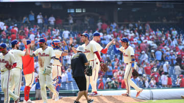 Jun 30, 2024; Philadelphia, Pennsylvania, USA; Philadelphia Phillies shortstop Trea Turner (7) and second base Bryson Stott (5) celebrate win with teammates against the Miami Marlins at Citizens Bank Park. Mandatory Credit: Eric Hartline-USA TODAY Sports