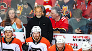 Oct 12, 2024; Calgary, Alberta, CAN; Philadelphia Flyers head coach John Tortorella on his bench against the Calgary Flames during the first period at Scotiabank Saddledome. Mandatory Credit: Sergei Belski-Imagn Images