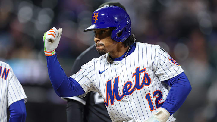 May 27, 2025; New York City, New York, USA; New York Mets shortstop Francisco Lindor (12) reacts after hitting a two RBI single during the eighth inning against the Chicago White Sox at Citi Field. Mandatory Credit: Vincent Carchietta-Imagn Images