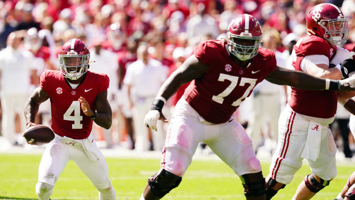 Oct 14, 2023; Tuscaloosa, Alabama, USA; Alabama Crimson Tide quarterback Jalen Milroe (4) runs out of the pocket against the Arkansas Razorbacks during the second half at Bryant-Denny Stadium. Mandatory Credit: John David Mercer-USA TODAY Sports