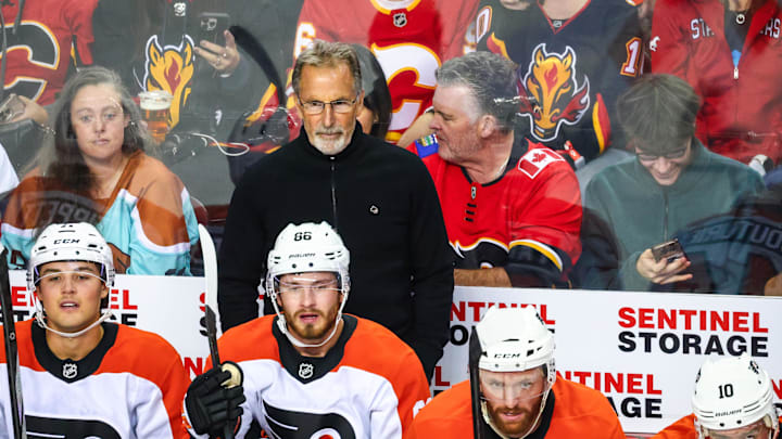 Oct 12, 2024; Calgary, Alberta, CAN; Philadelphia Flyers head coach John Tortorella on his bench against the Calgary Flames during the first period at Scotiabank Saddledome. Mandatory Credit: Sergei Belski-Imagn Images Oct 12, 2024; Calgary, Alberta, CAN; Philadelphia Flyers head coach John Tortorella on his bench against the Calgary Flames during the first period at Scotiabank Saddledome. Mandatory Credit: Sergei Belski-Imagn Images
