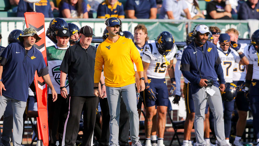 Sep 6, 2025; Athens, Ohio, USA; West Virginia Mountaineers defensive coordinator Zac Alley watches a play during the third quarter against the Ohio Bobcats at Peden Stadium. Mandatory Credit: Ben Queen-Imagn Images