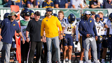 Sep 6, 2025; Athens, Ohio, USA; West Virginia Mountaineers defensive coordinator Zac Alley watches a play during the third quarter against the Ohio Bobcats at Peden Stadium. Mandatory Credit: Ben Queen-Imagn Images