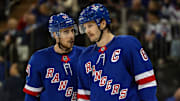 Nov 25, 2024; New York, New York, USA; New York Rangers right wing Reilly Smith (91) talks with defenseman Jacob Trouba (8) during a timeout against the St. Louis Blues during the first period at Madison Square Garden. Mandatory Credit: Danny Wild-Imagn Images
