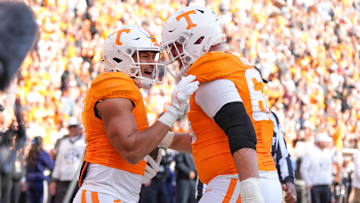 Tennessee wide receiver Bru McCoy (5) and Tennessee offensive lineman Dayne Davis (66) celebrate after a touchdown during a NCAA football game between Tennessee and UTEP in Neyland Stadium on Saturday, November 23, 2024.