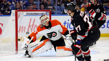 Apr 17, 2025; Buffalo, New York, USA;  Buffalo Sabres right wing JJ Peterka (77) scores a goal on Philadelphia Flyers goaltender Aleksei Kolosov (35) during the second period at KeyBank Center. Mandatory Credit: Timothy T. Ludwig-Imagn Images